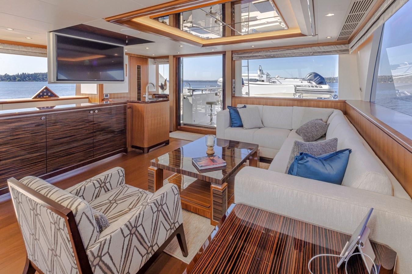 a living room with a couch and a coffee table aboard LANIKAI Yacht for Sale