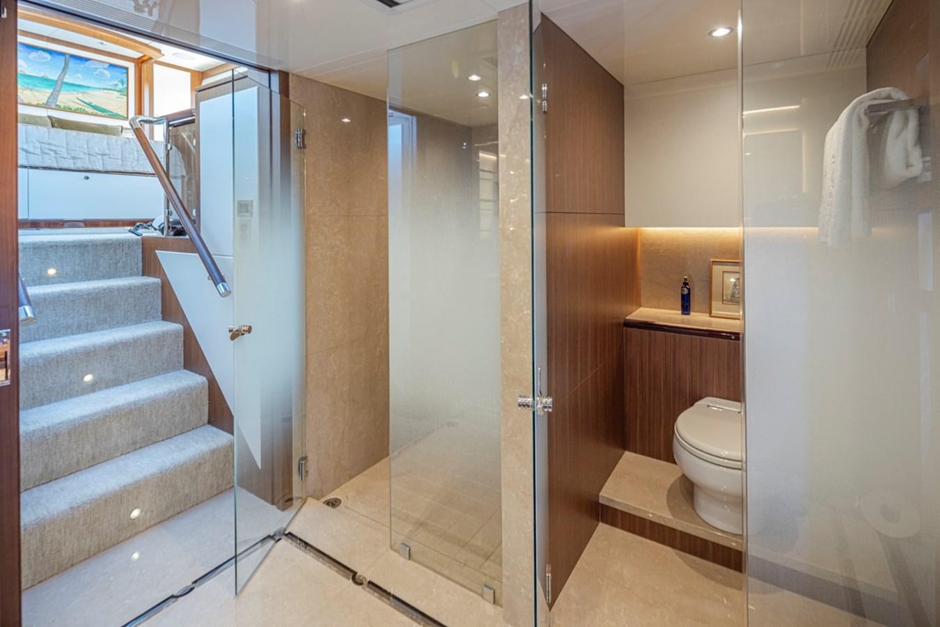 a bathroom with a glass door aboard LANIKAI Yacht for Sale