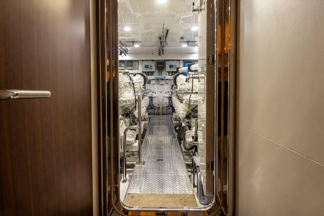 a hallway with a glass door aboard LANIKAI Yacht for Sale