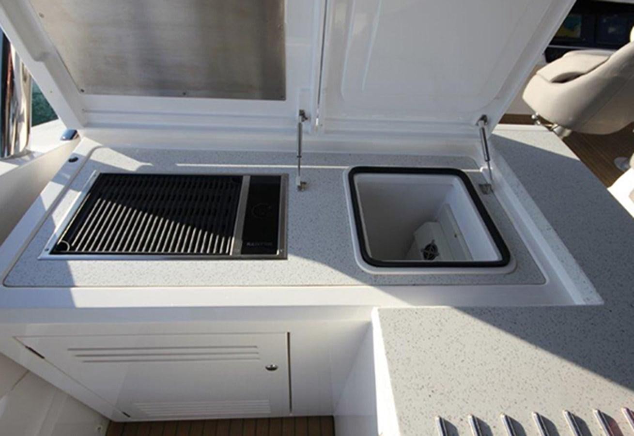 a white car with a black panel aboard MIBOWT Yacht for Sale