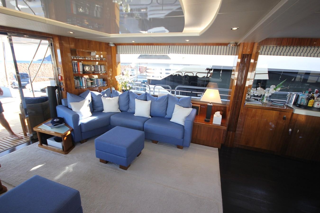 a room with a couch and a table aboard MIBOWT Yacht for Sale