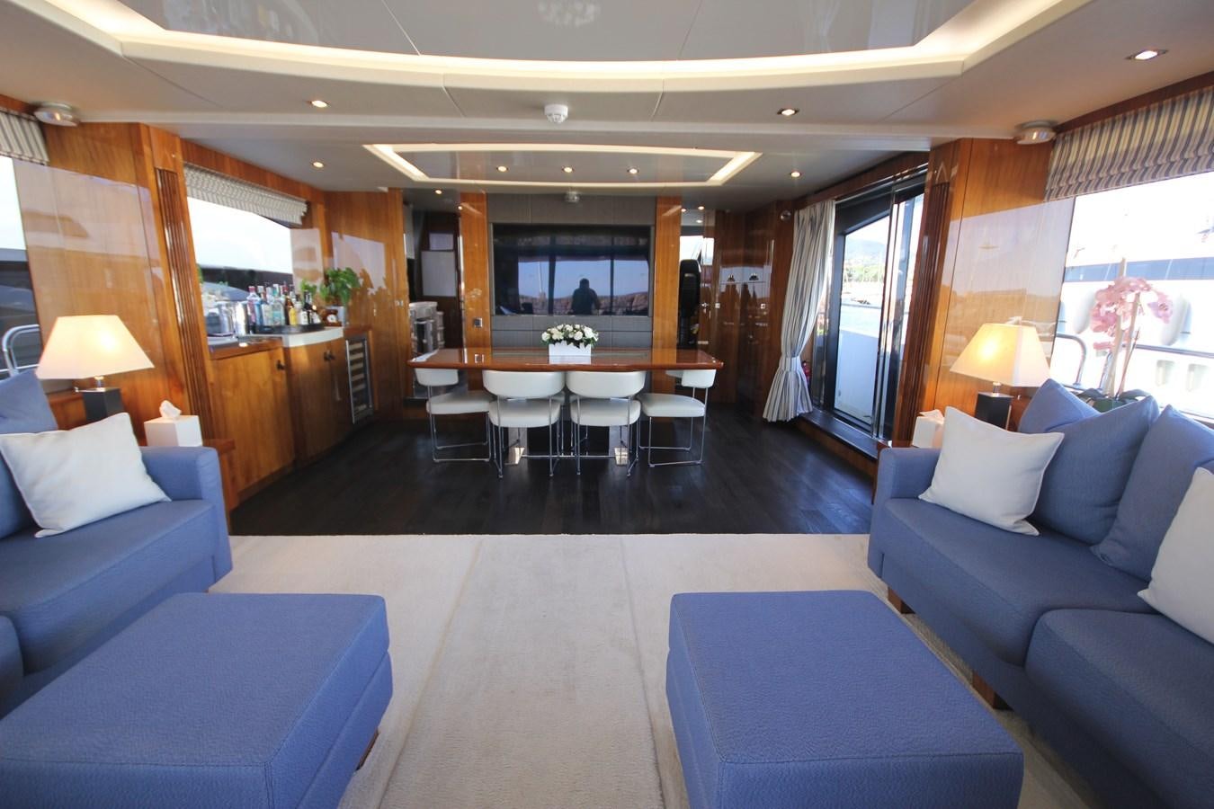 a room with a table and chairs aboard MIBOWT Yacht for Sale