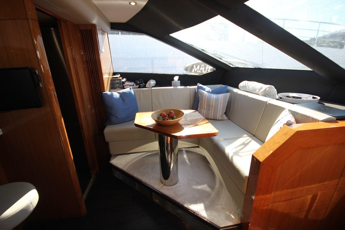 a table with a plate of food on it aboard MIBOWT Yacht for Sale
