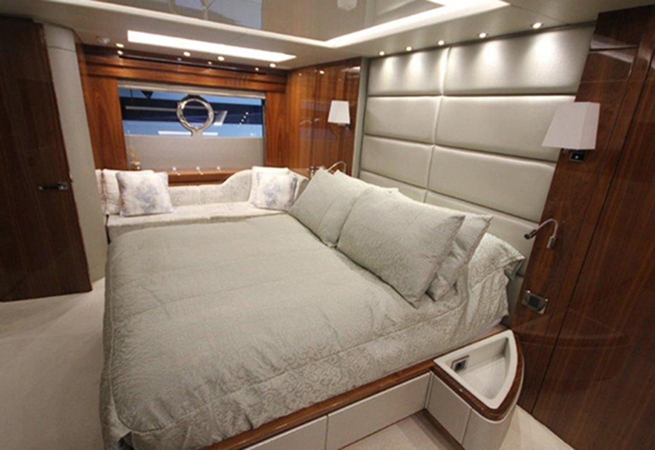 a bed with a mirror above it aboard MIBOWT Yacht for Sale