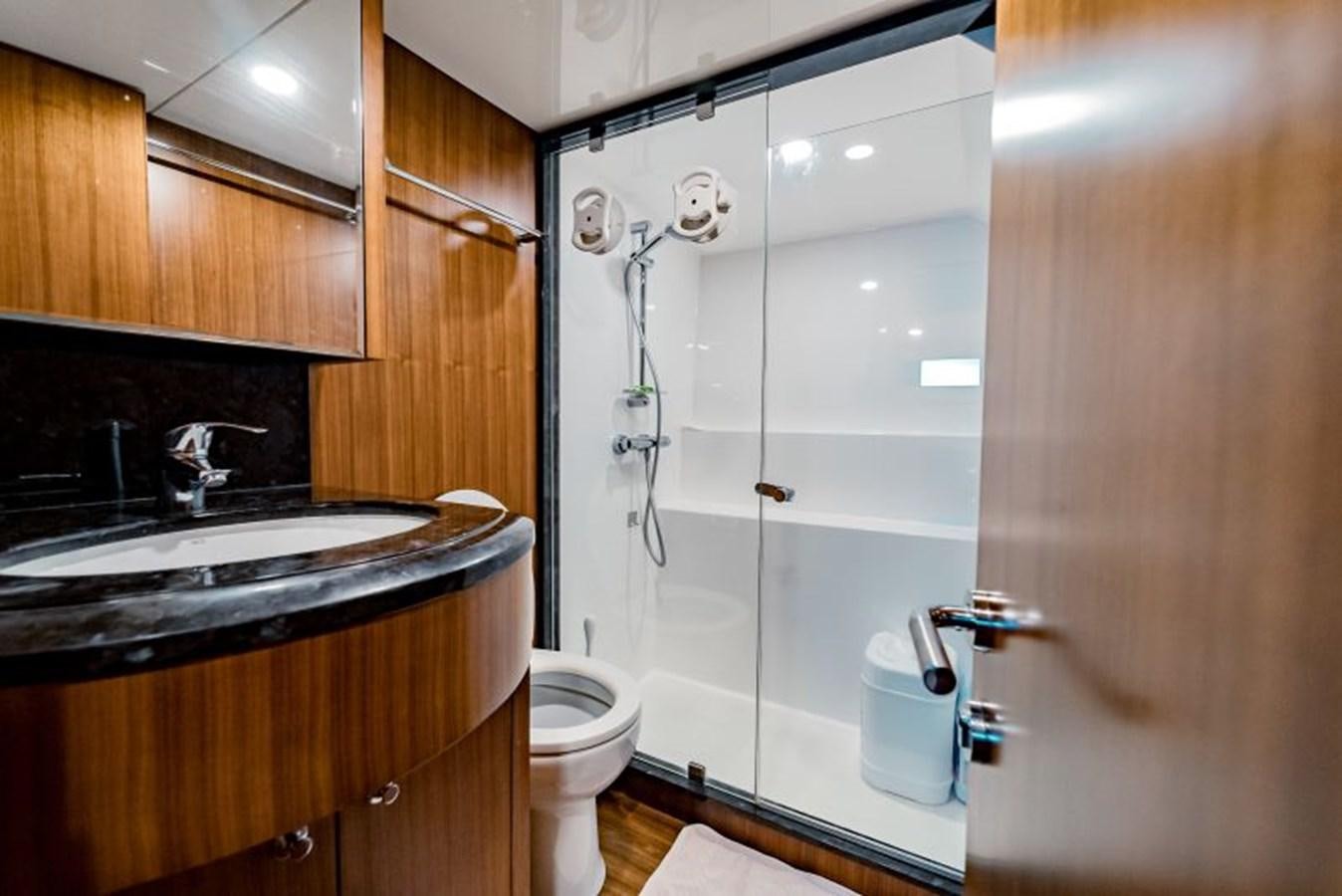 a bathroom with a shower and sink aboard SWEET SALT Yacht for Sale