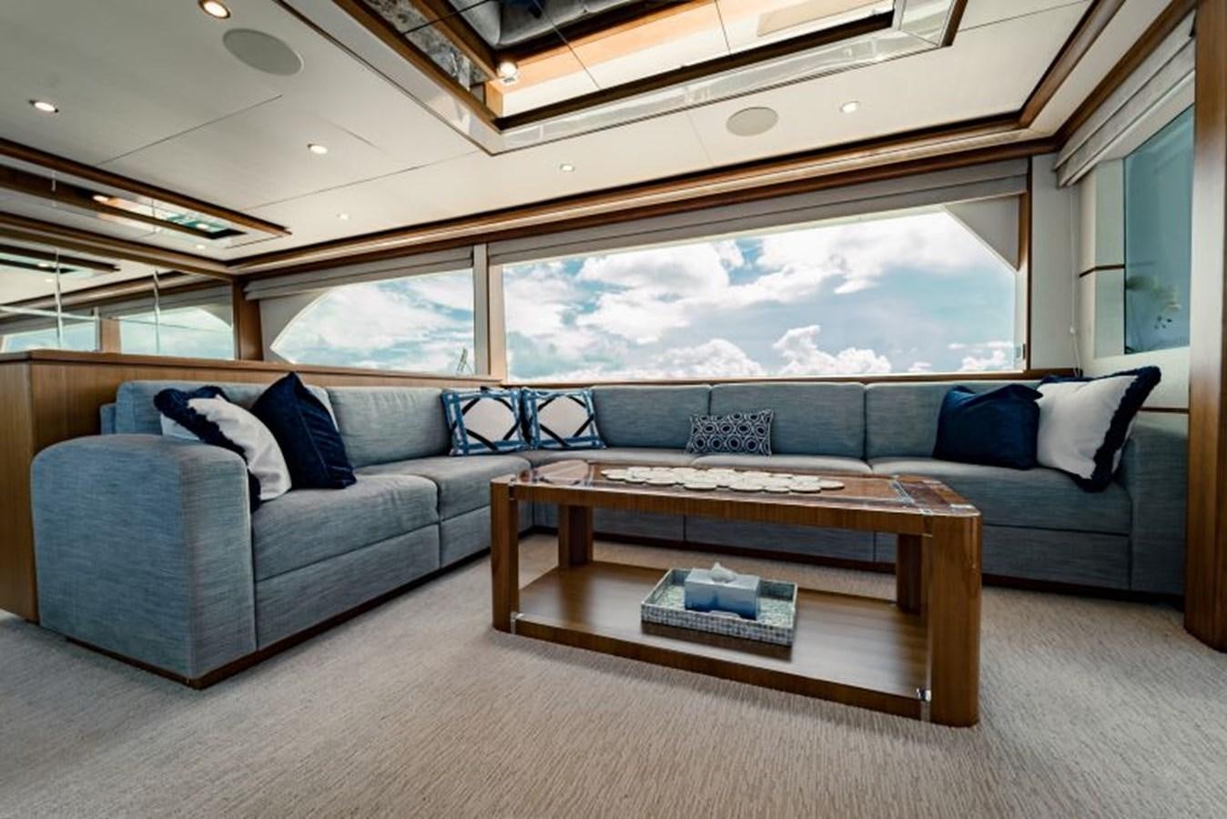 a living room with a couch and a table aboard SWEET SALT Yacht for Sale