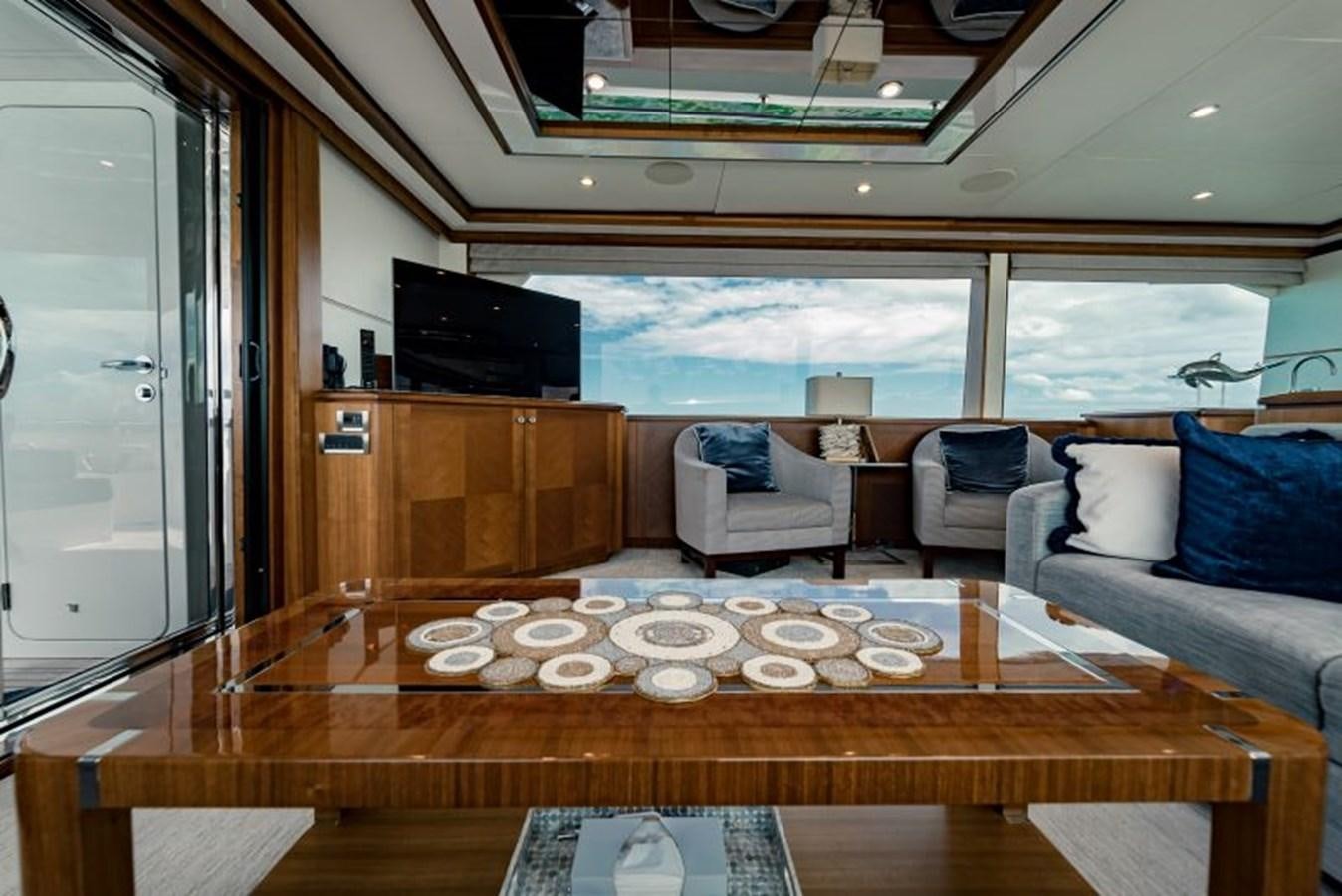 a large wooden table in a living room aboard SWEET SALT Yacht for Sale