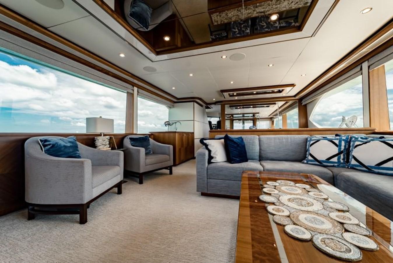 a large living room with a large open window aboard SWEET SALT Yacht for Sale
