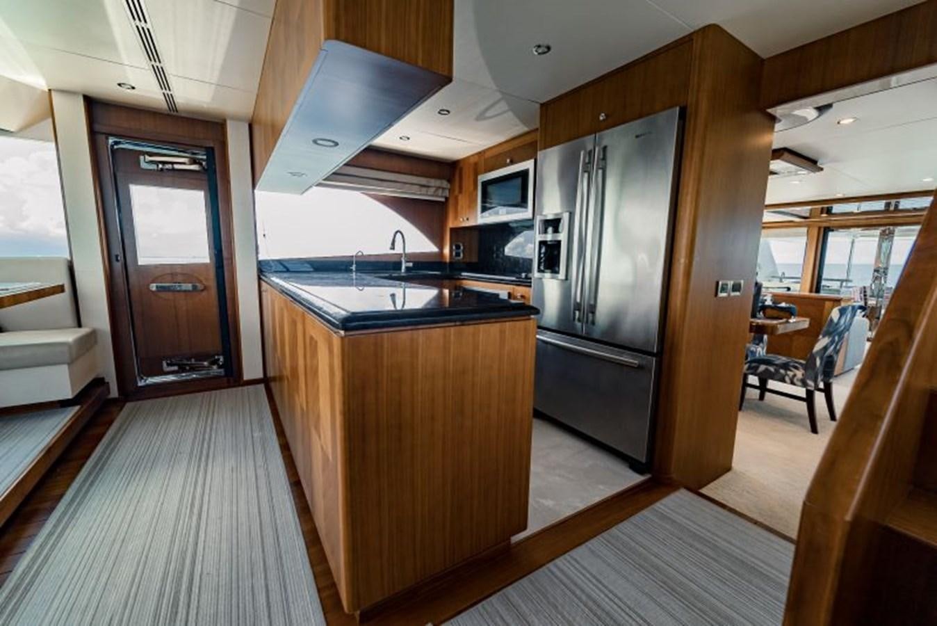 a kitchen with a wood floor aboard SWEET SALT Yacht for Sale
