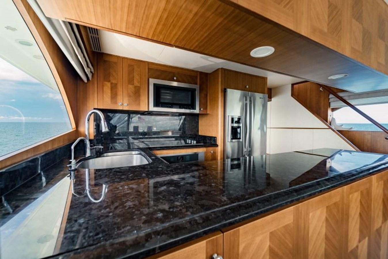 a kitchen with a microwave oven and a sink aboard SWEET SALT Yacht for Sale
