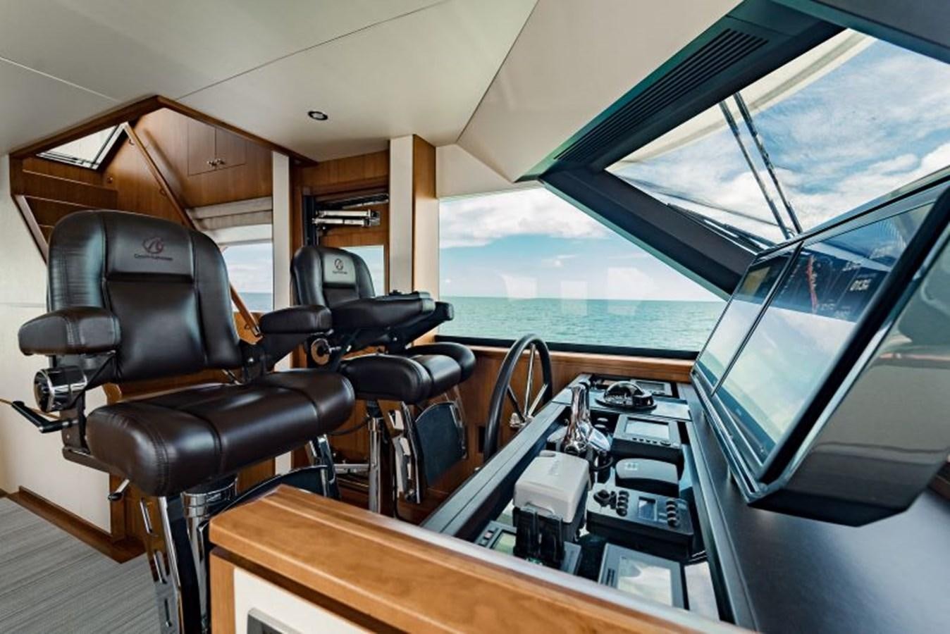 a vehicle with a seat and a desk with a computer on it aboard SWEET SALT Yacht for Sale