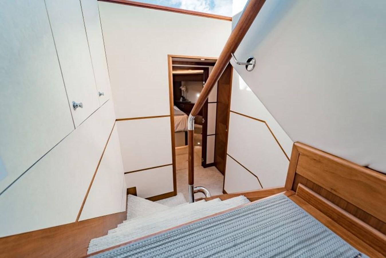 a staircase with a wood railing aboard SWEET SALT Yacht for Sale