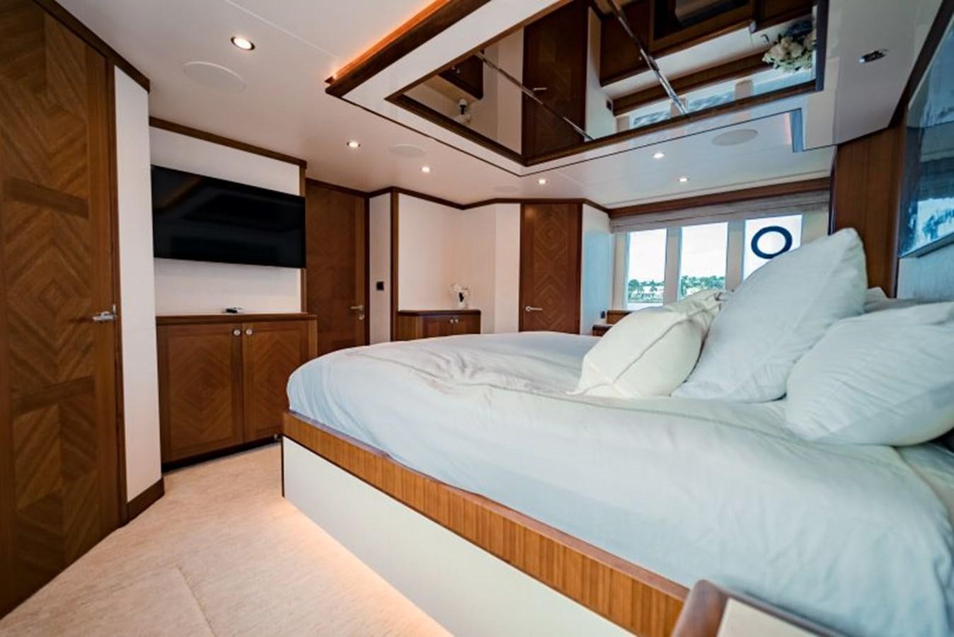a bedroom with a bed and a television aboard SWEET SALT Yacht for Sale