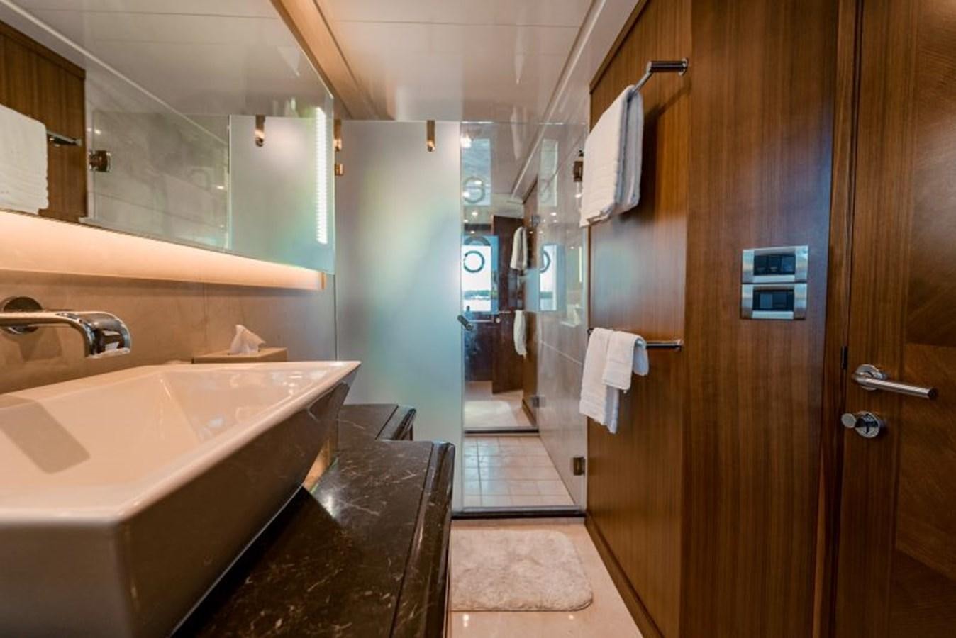 a bathroom with a sink and a mirror aboard SWEET SALT Yacht for Sale
