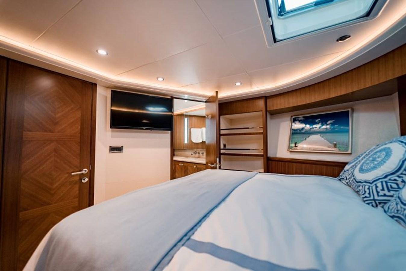 a bedroom with a bed and a closet aboard SWEET SALT Yacht for Sale