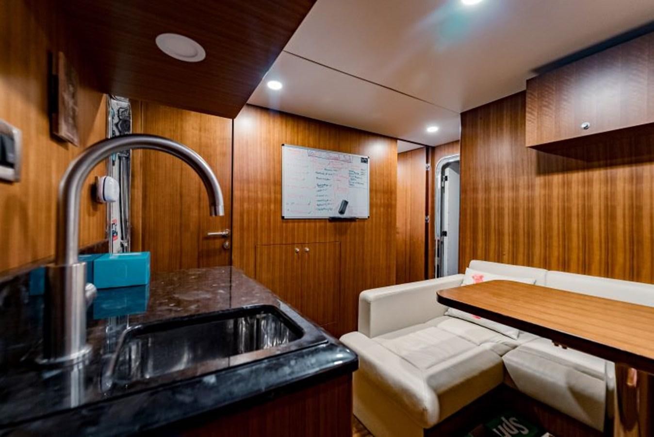 a bathroom with a sink and a bed aboard SWEET SALT Yacht for Sale