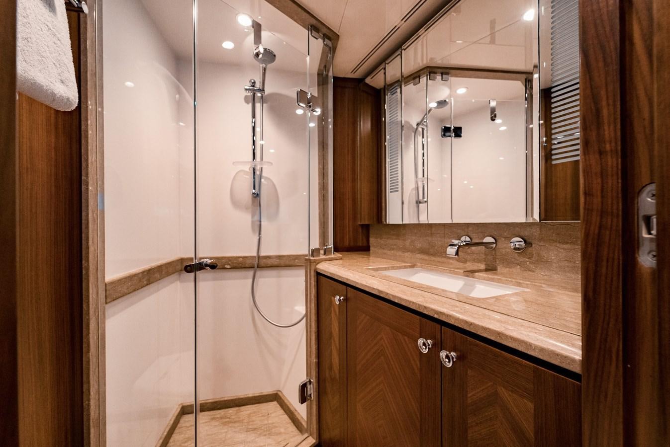 a bathroom with a shower unit and sink aboard SWEET SALT Yacht for Sale