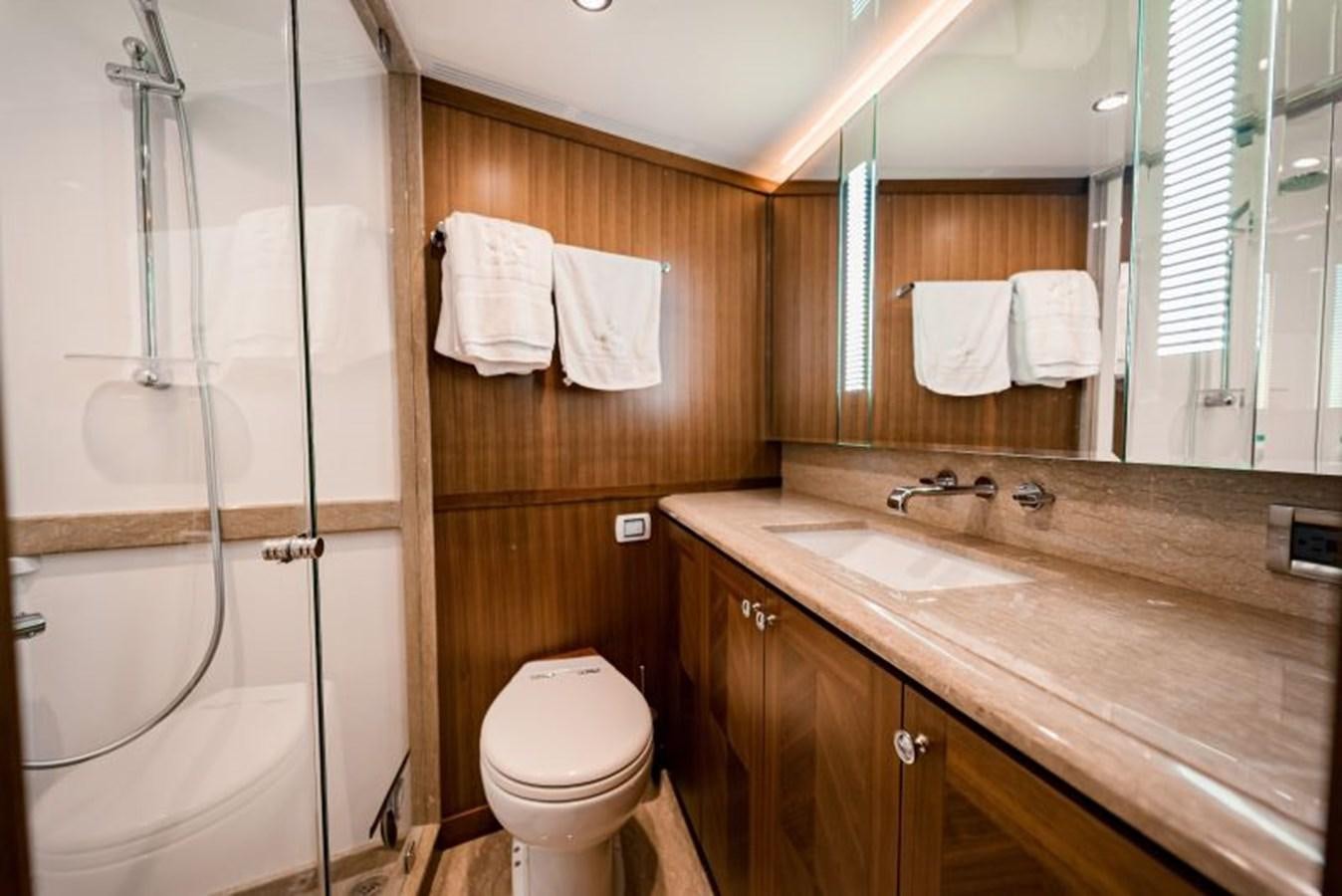 a bathroom with a sink toilet and a shower aboard SWEET SALT Yacht for Sale