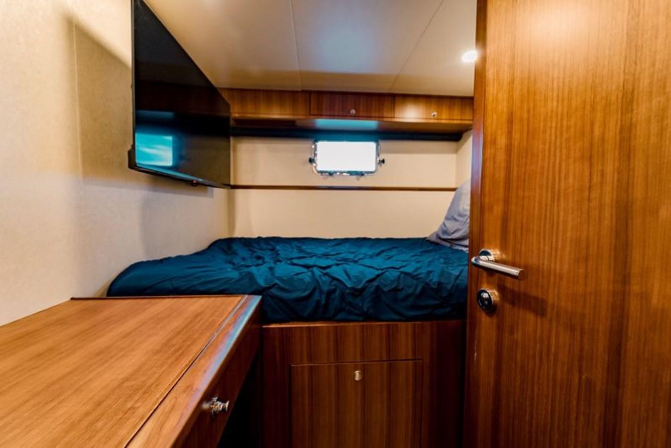 a person lying on a bed aboard SWEET SALT Yacht for Sale