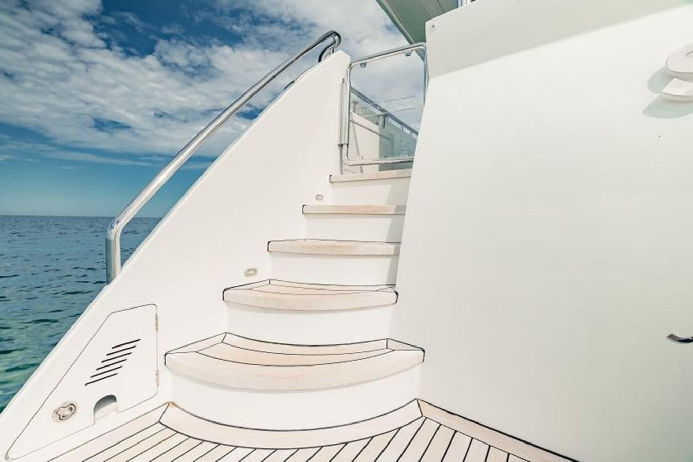 a white boat on a deck aboard SWEET SALT Yacht for Sale