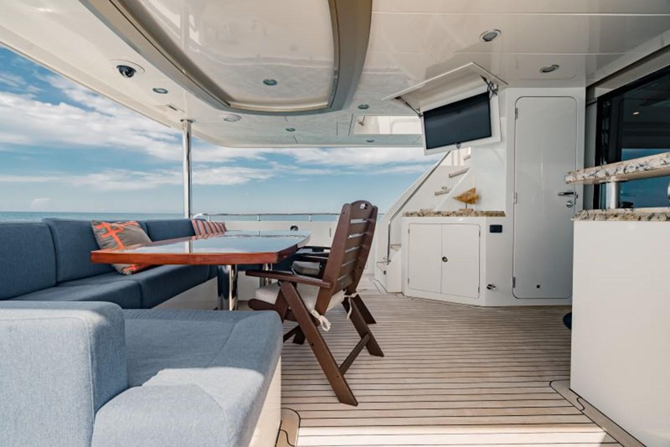 a boat with a table and chairs aboard SWEET SALT Yacht for Sale