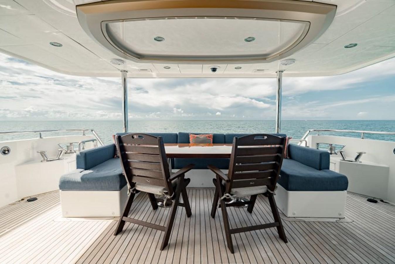 a table and chairs on a deck aboard SWEET SALT Yacht for Sale