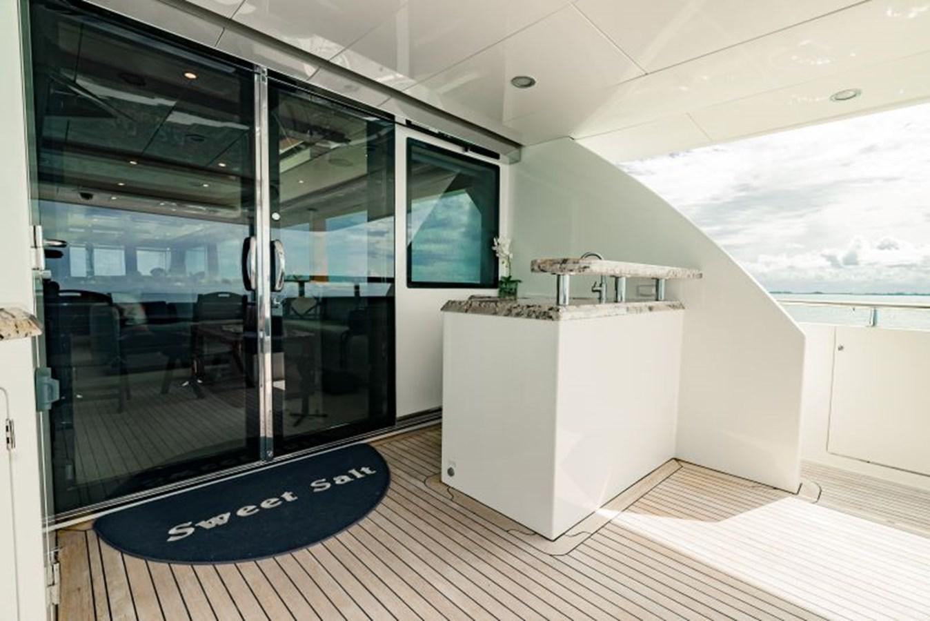 a room with a large glass door aboard SWEET SALT Yacht for Sale