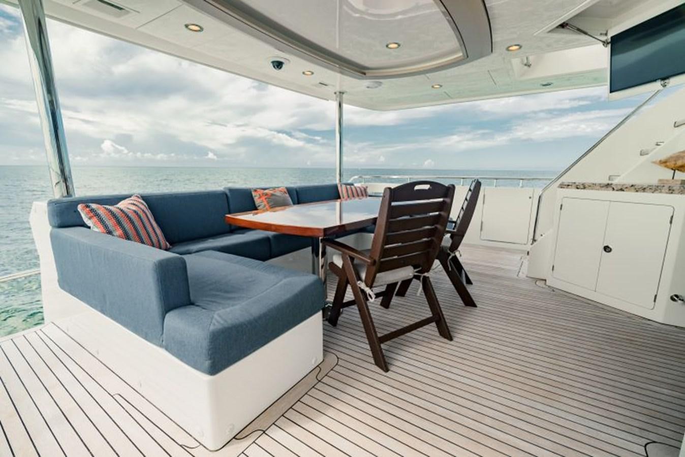 a boat with a table and chairs aboard SWEET SALT Yacht for Sale