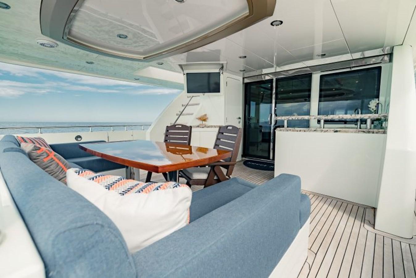 a living room with a couch and a table aboard SWEET SALT Yacht for Sale