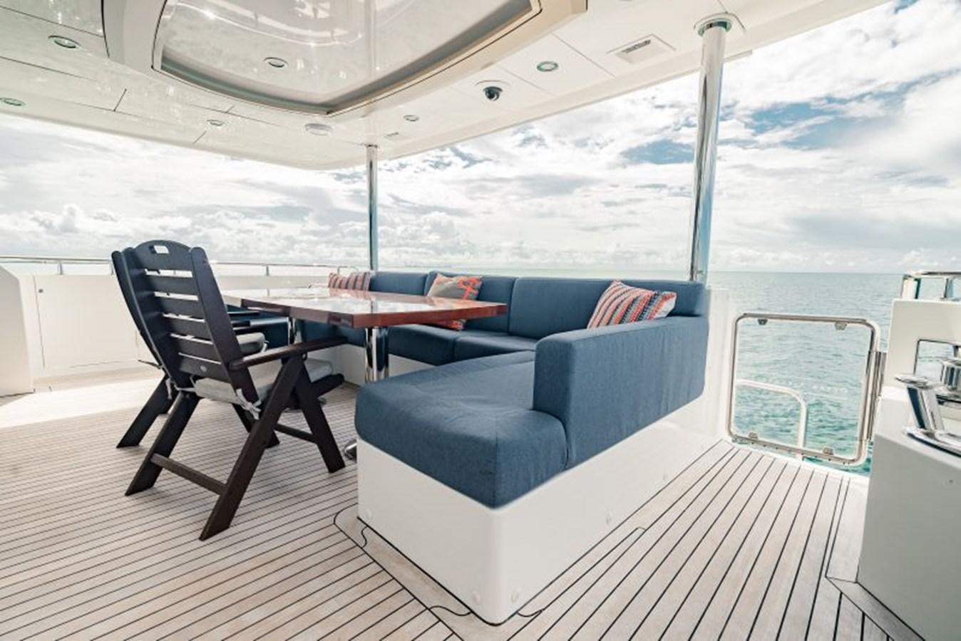 a boat with a couch and a table aboard SWEET SALT Yacht for Sale