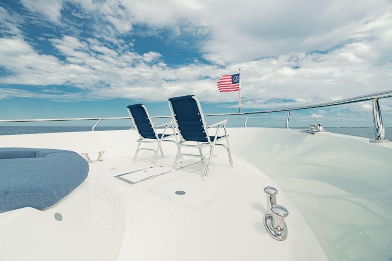 chairs and a flag on a boat aboard SWEET SALT Yacht for Sale