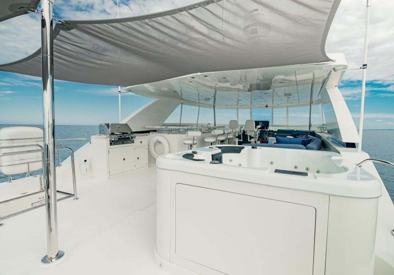 a white room with a large white table and a white table aboard SWEET SALT Yacht for Sale