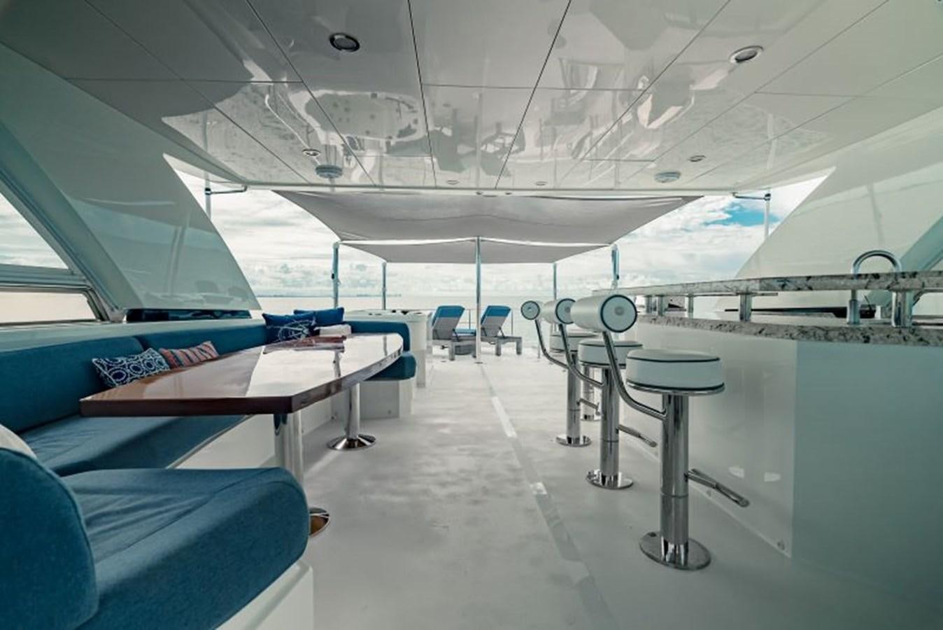 a room with tables and chairs aboard SWEET SALT Yacht for Sale