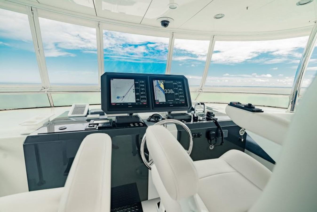 a room with computers and chairs aboard SWEET SALT Yacht for Sale