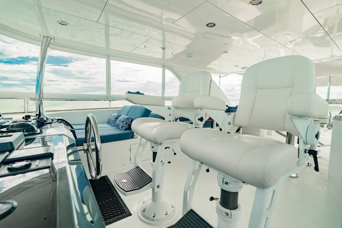 a room with chairs and computers aboard SWEET SALT Yacht for Sale