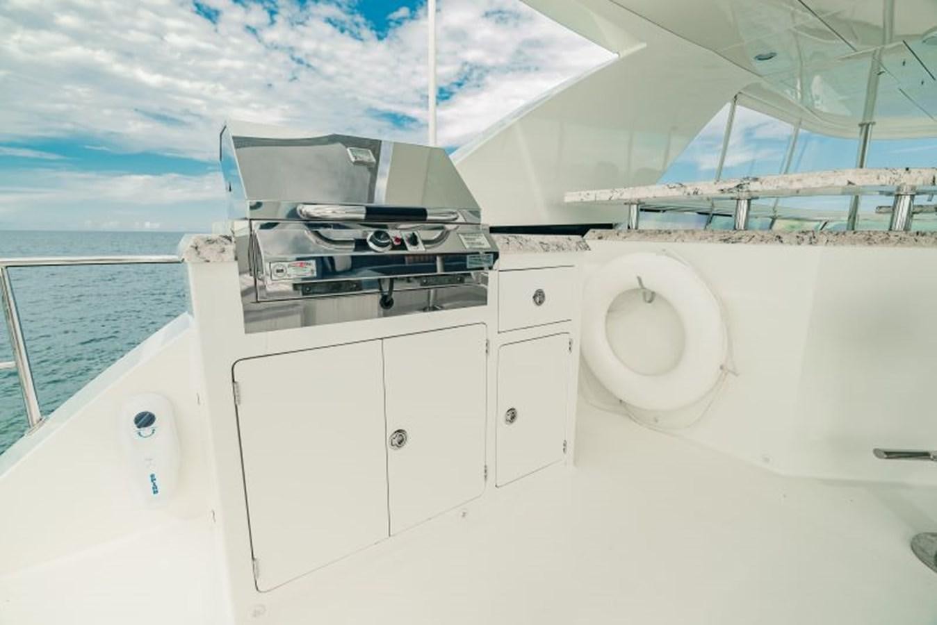 a white boat with a white cover aboard SWEET SALT Yacht for Sale