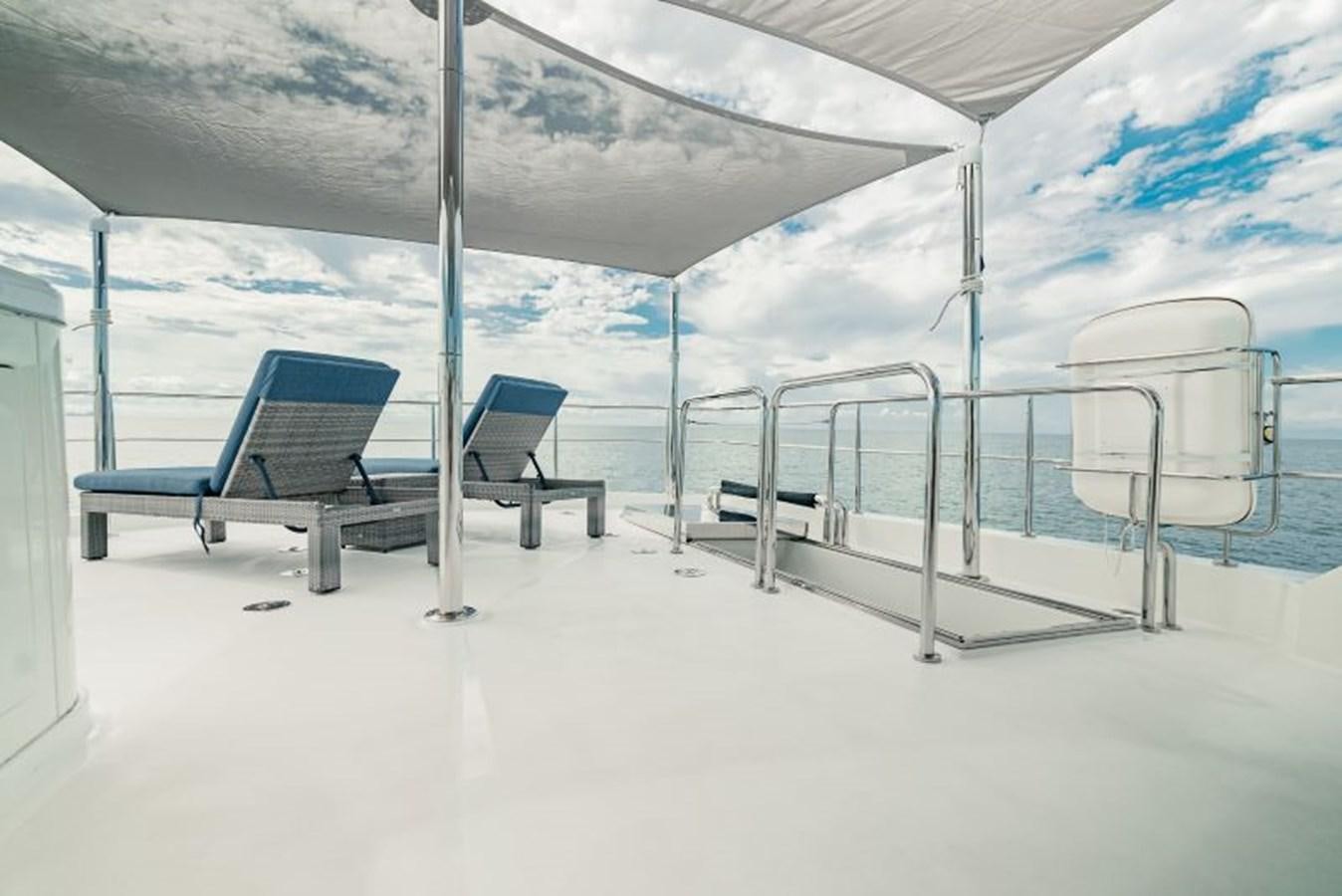 a boat with chairs on it aboard SWEET SALT Yacht for Sale