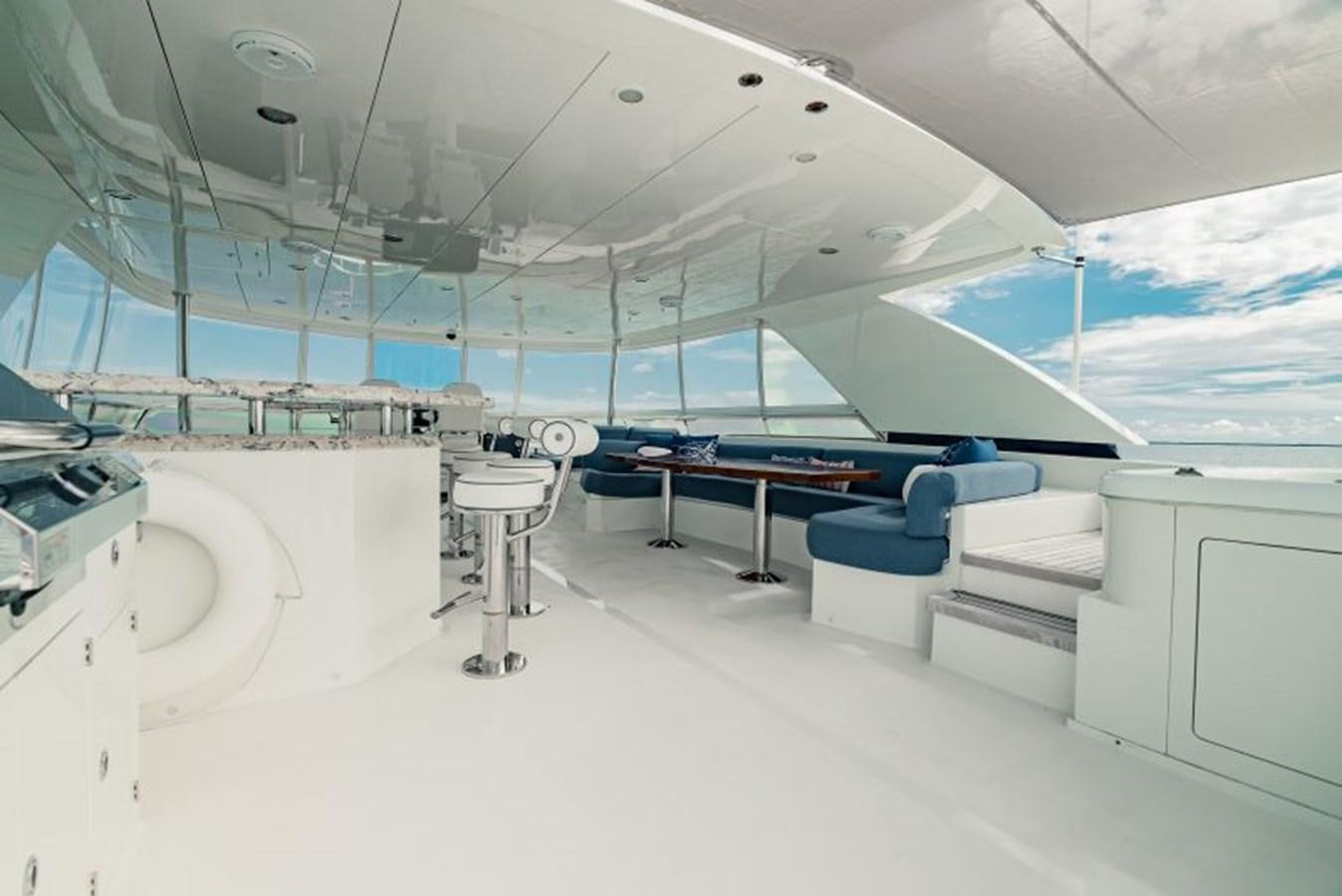 a room with a pool table and chairs aboard SWEET SALT Yacht for Sale