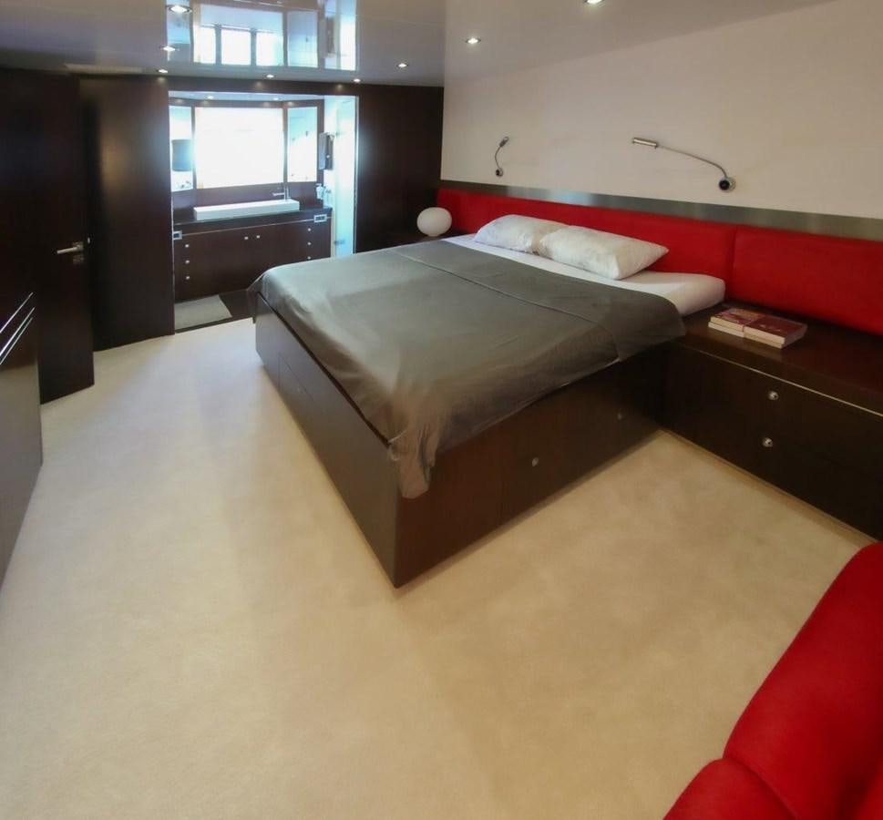 a bed in a room aboard POCO LOCO Yacht for Sale