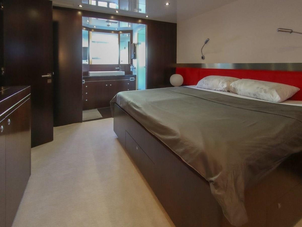 a bed in a room aboard POCO LOCO Yacht for Sale