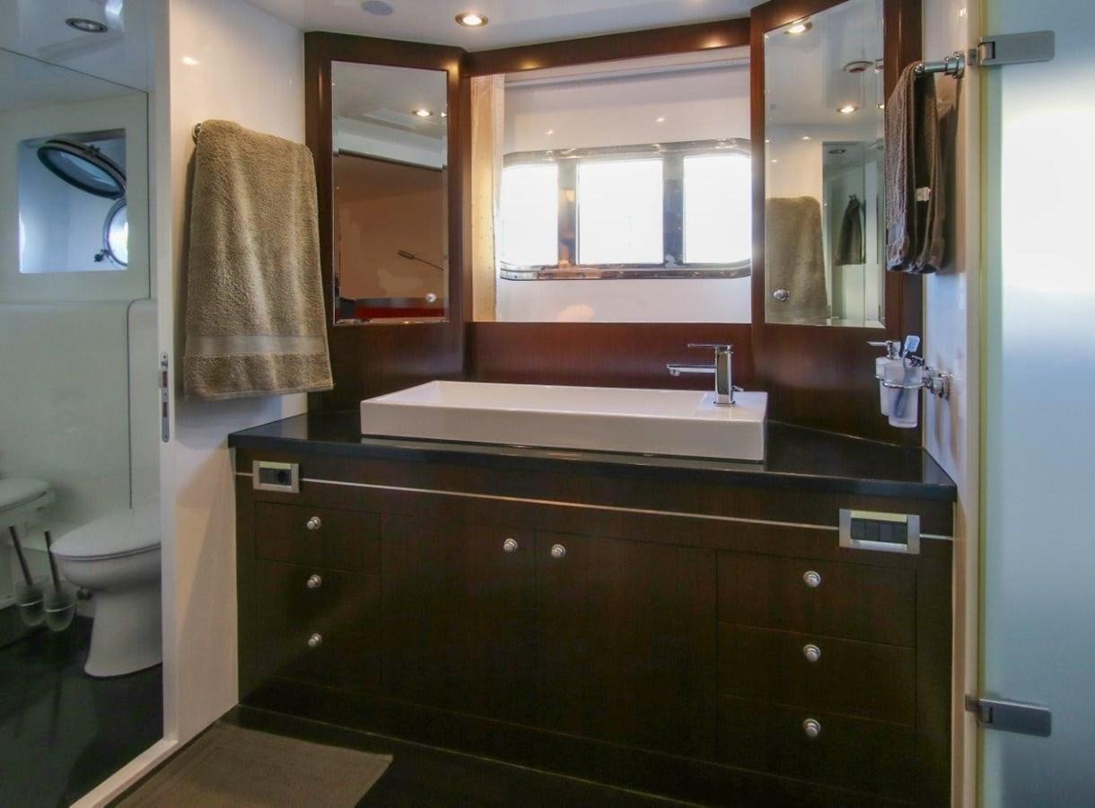 a bathroom with a sink and a toilet aboard POCO LOCO Yacht for Sale