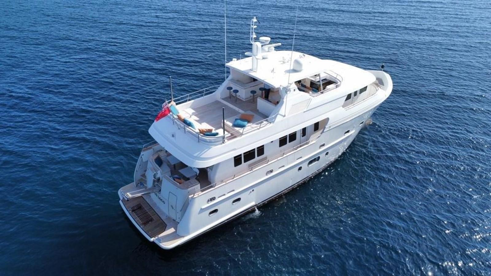 a white boat in the water aboard POCO LOCO Yacht for Sale