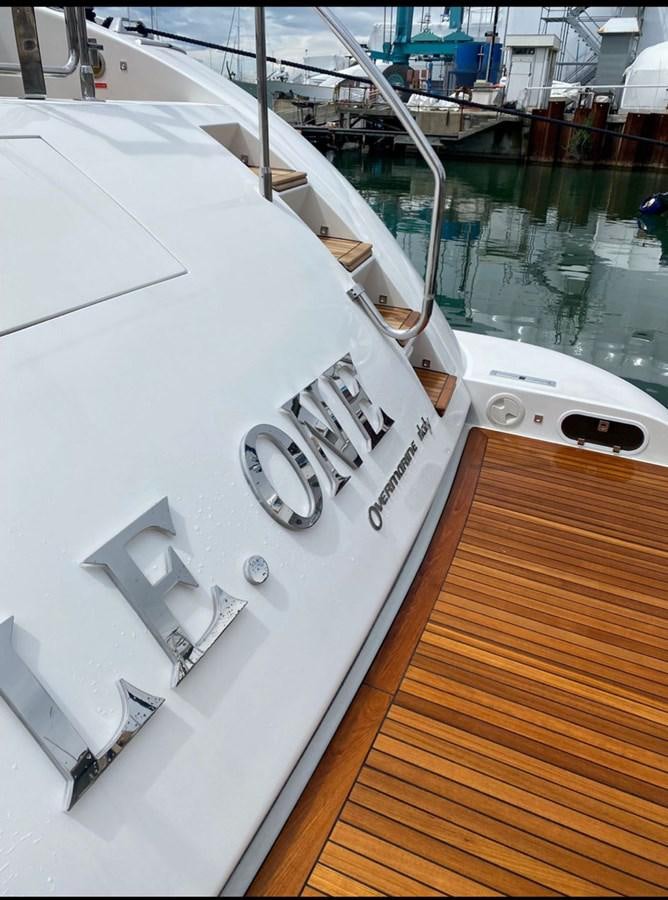 a white yacht with a wooden deck aboard LE.ONE Yacht for Sale