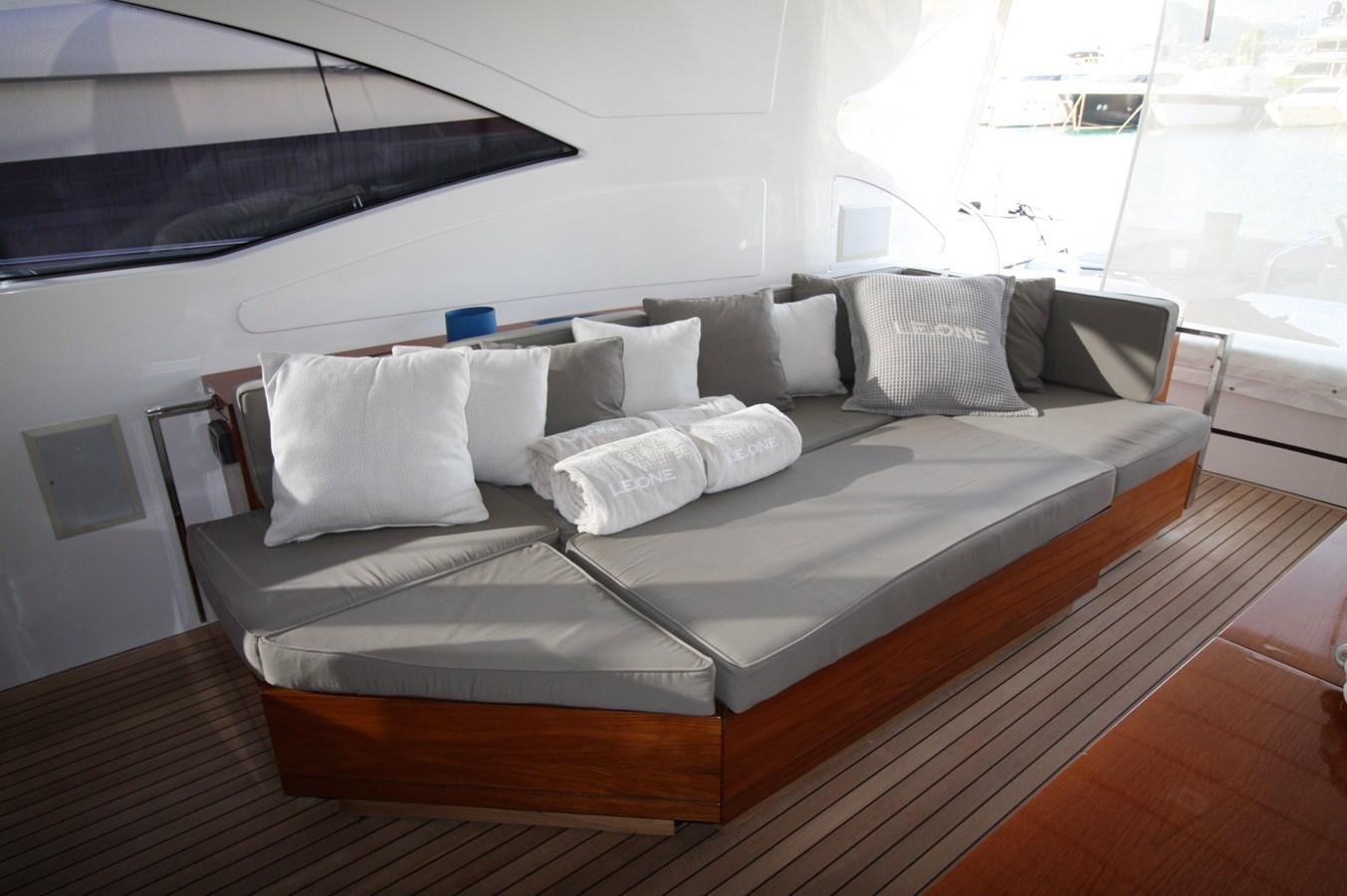 a bed with white pillows aboard LE.ONE Yacht for Sale