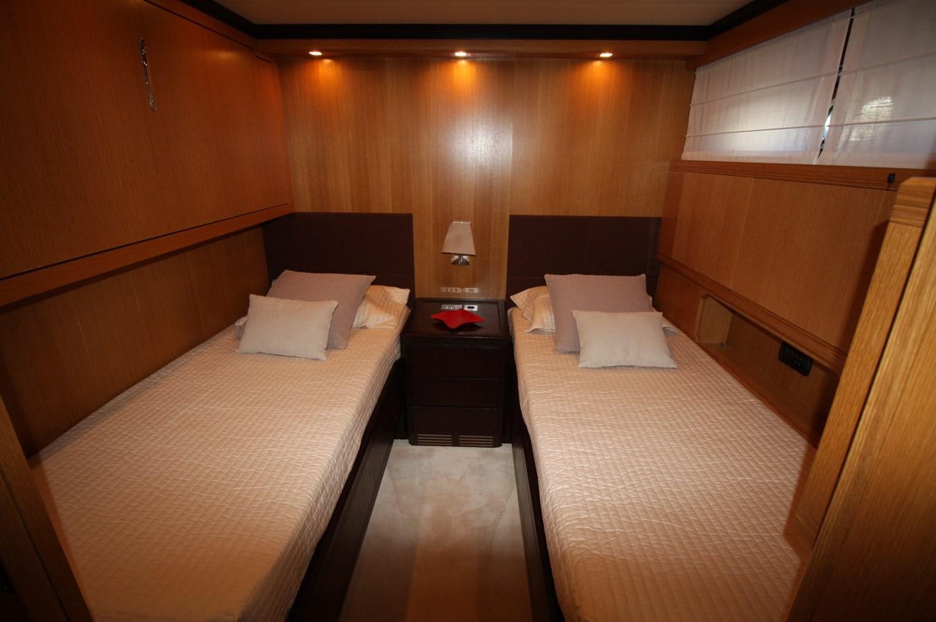 a room with two beds aboard LE.ONE Yacht for Sale