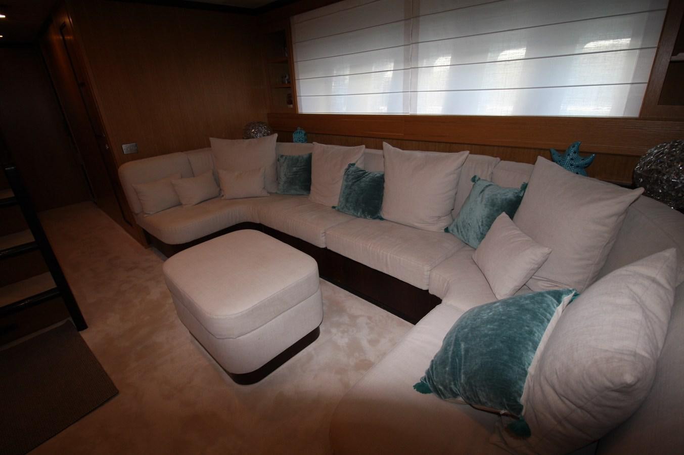 a couch with pillows aboard LE.ONE Yacht for Sale