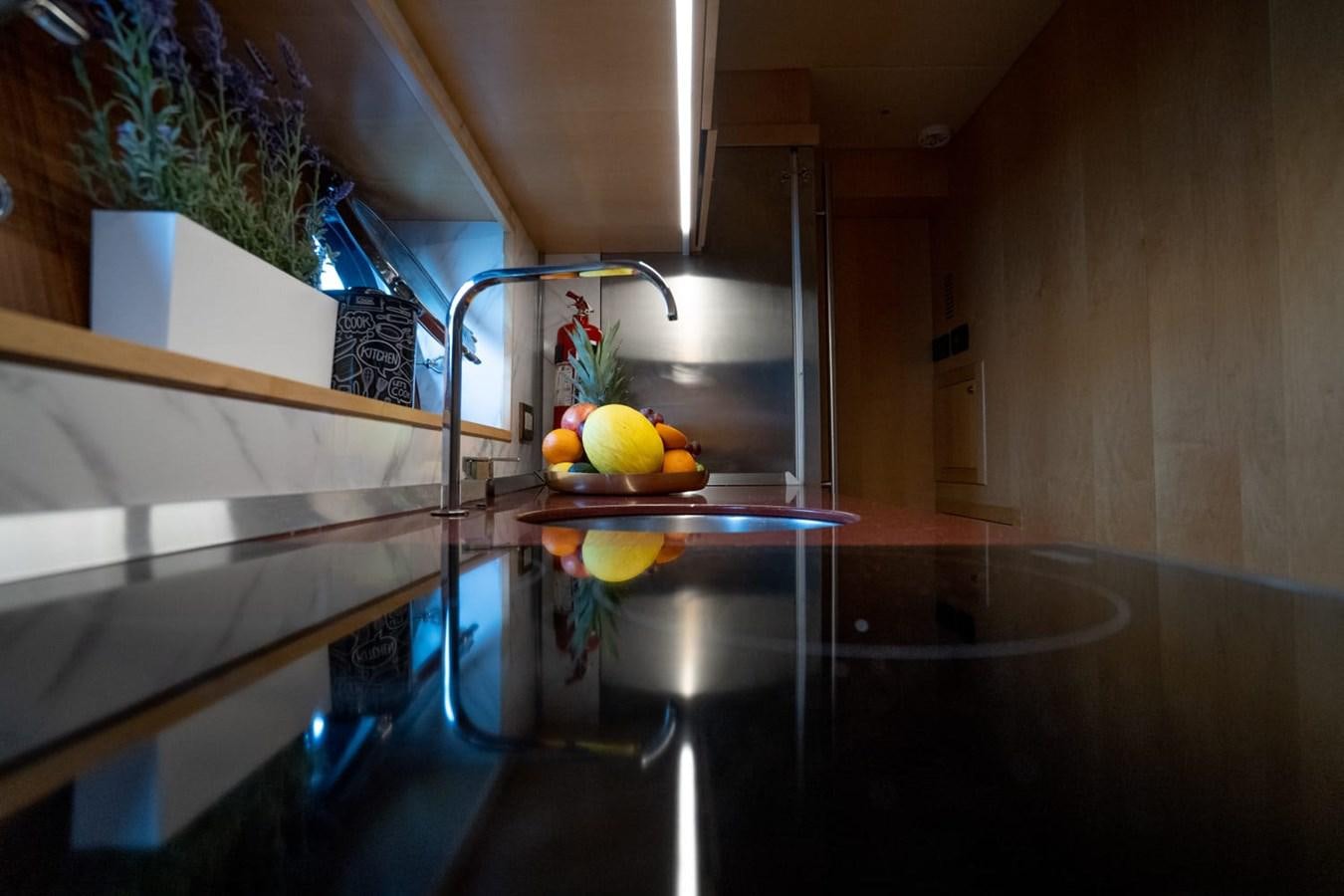 a kitchen with a glass sink aboard F68 Yacht for Sale