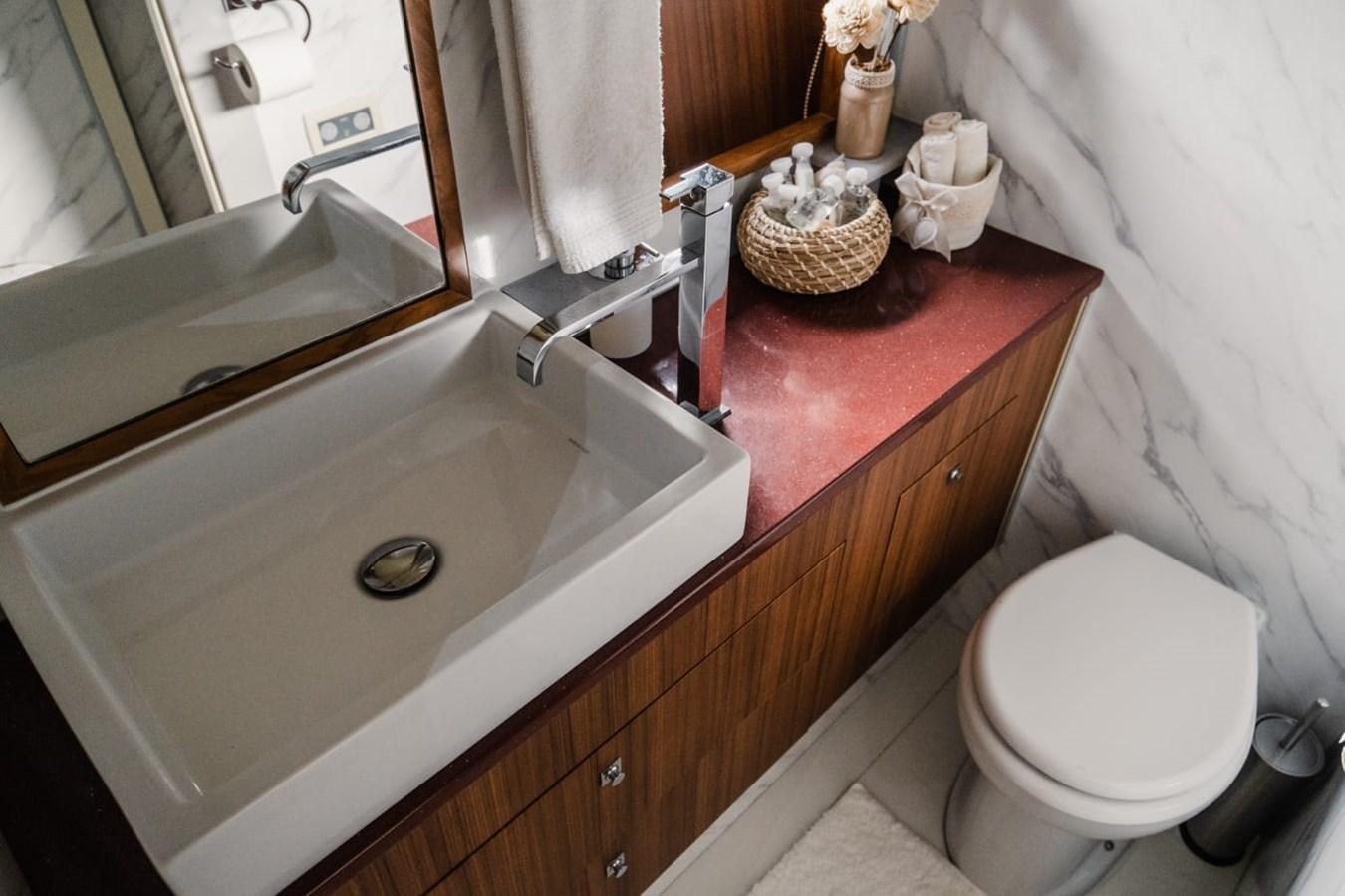 a bathroom with a sink and toilet aboard F68 Yacht for Sale