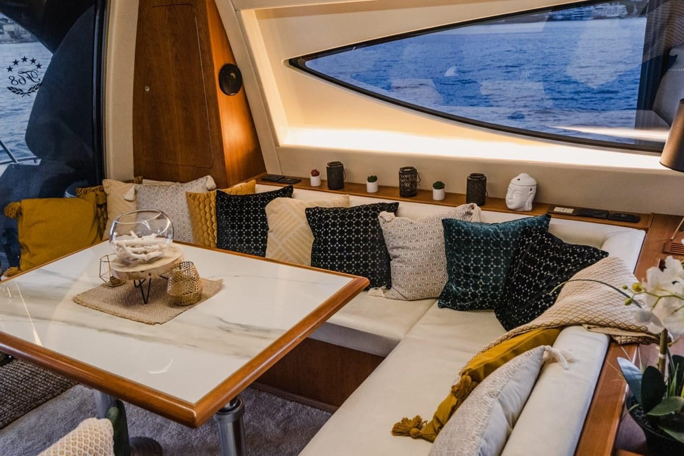 a room with a bed and a table aboard F68 Yacht for Sale