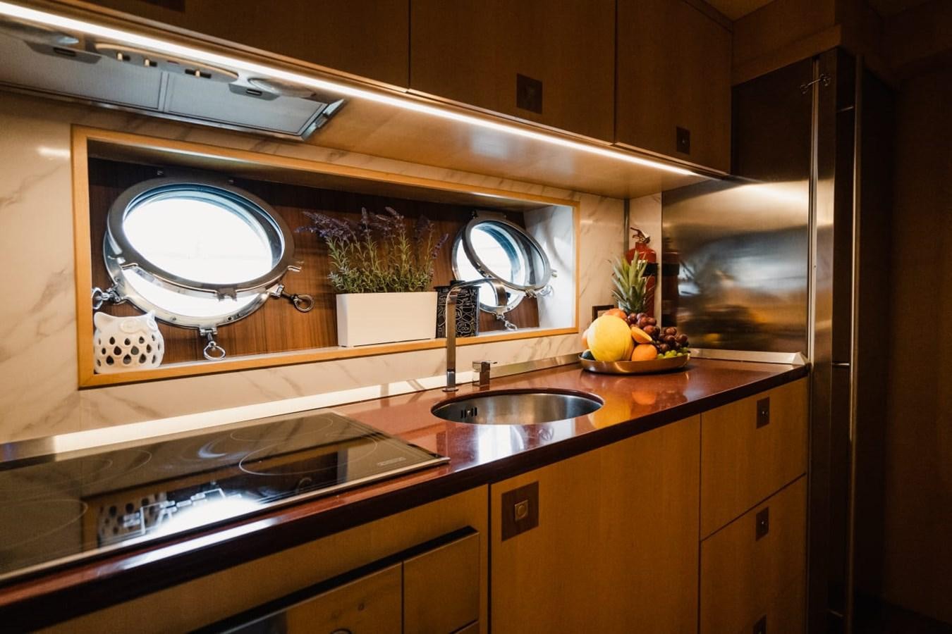 a kitchen with a large mirror aboard F68 Yacht for Sale